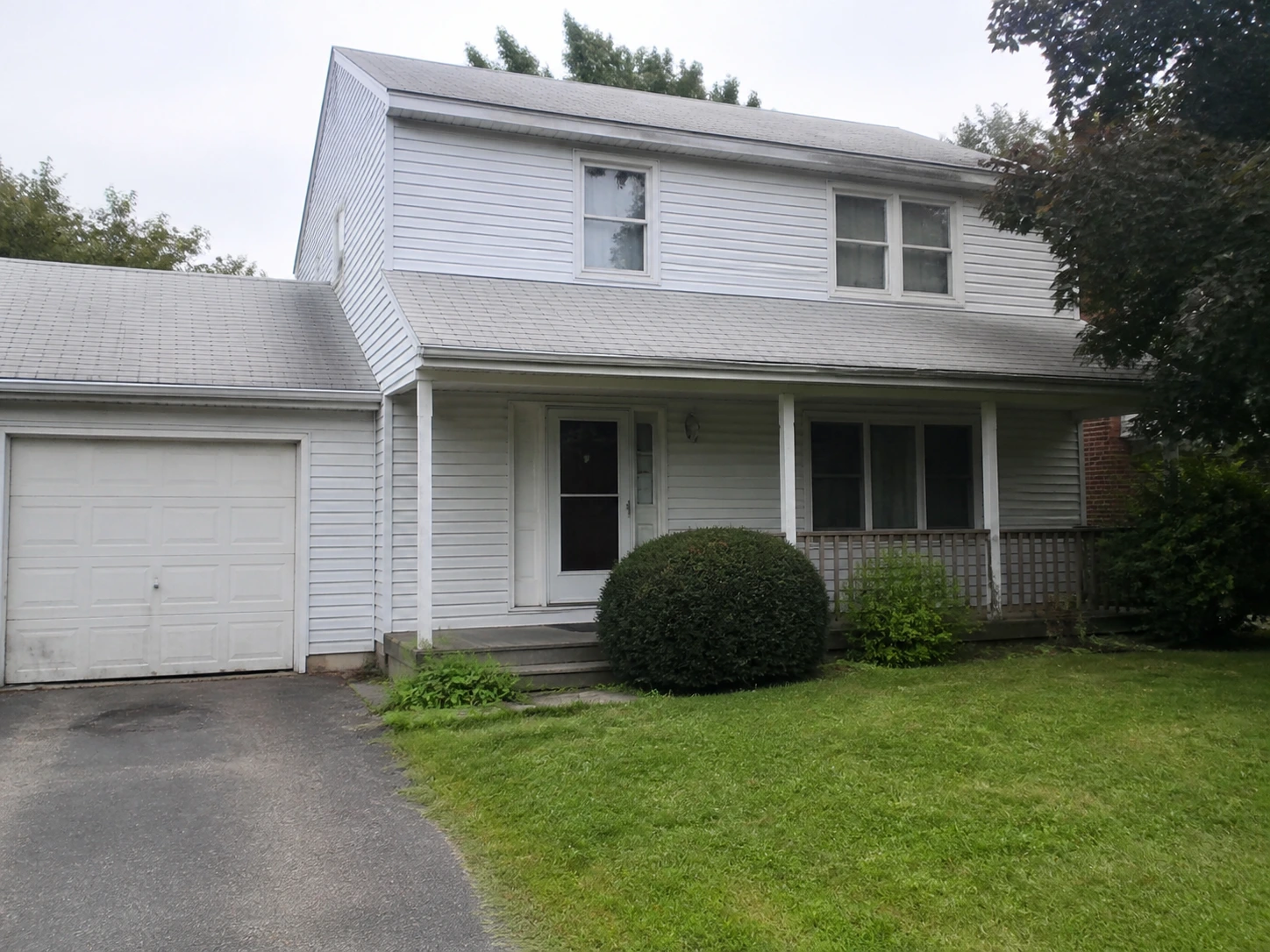 Real photo of an existing suburban house before restyling
