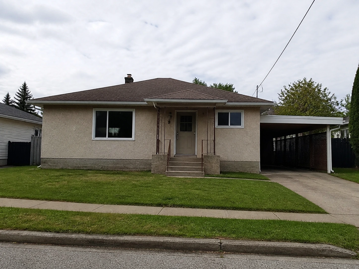 Plain real estate listing photo of a bungalow before restyling