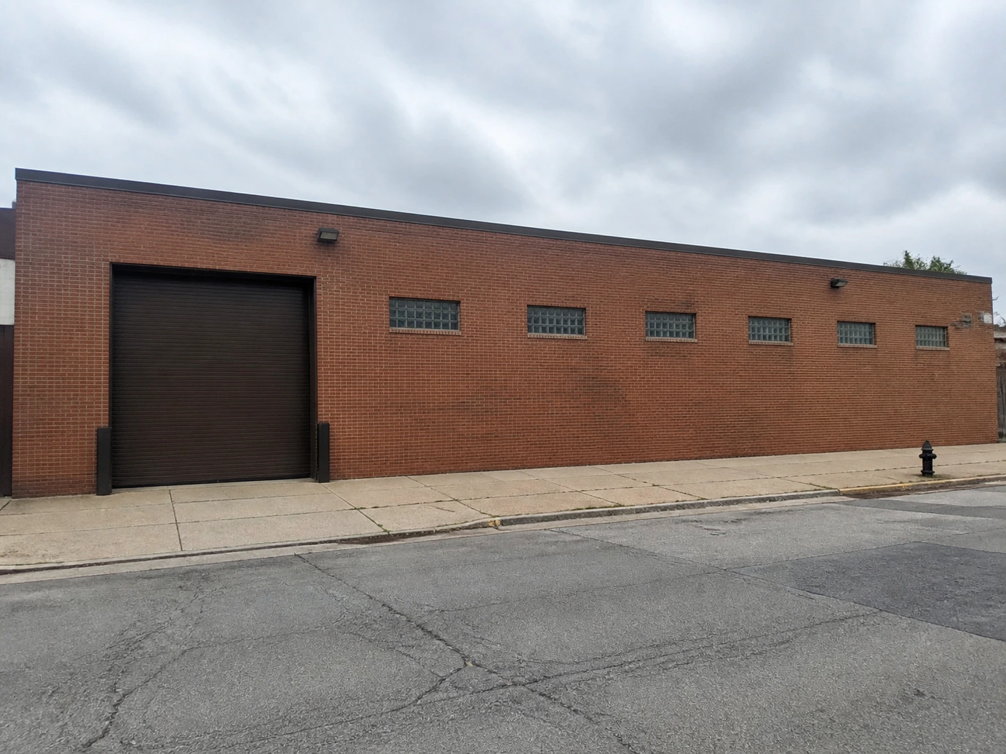 Real photo of an existing warehouse building before restyling